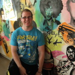 Cal U Student Alex Lafferty (center) graphics major, works to finish the Hip-Hop mural April 2012.