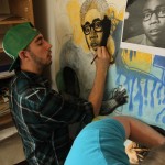Cal U Student Dylan Winters works to finish the Hip-Hop mural April 2012.